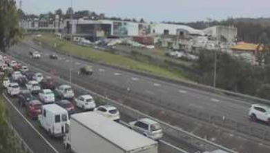 Truck rollover causes delays on M1